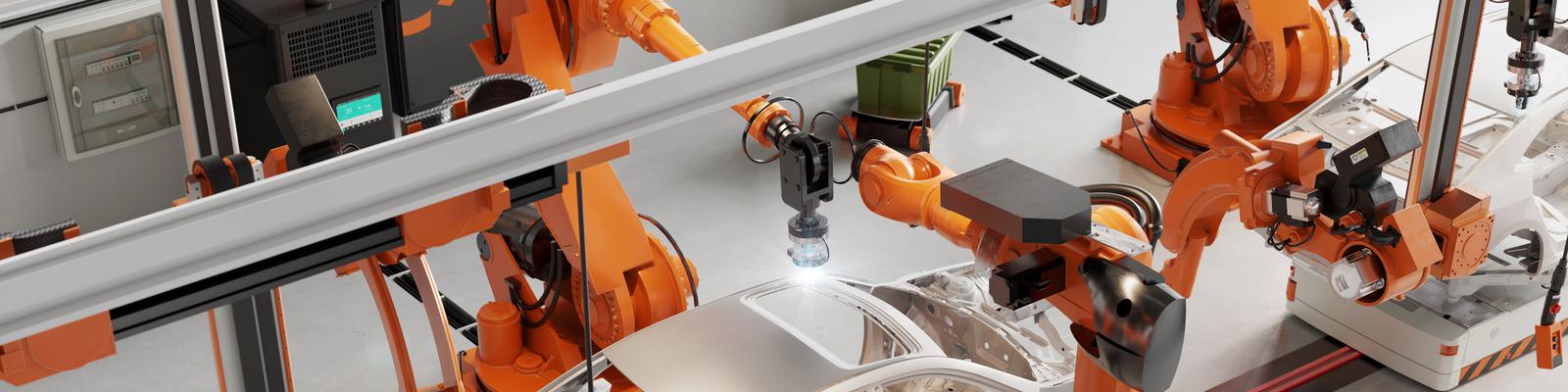 High angle view of car body welding shop with robotic arms welding the car parts. 3d rendering of automatic car manufacturing line in an automobile factory.